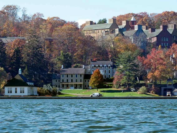 Photo of trees and homes along on a water front in Cold Spring Harbor National Lab in Long Island, New York.  