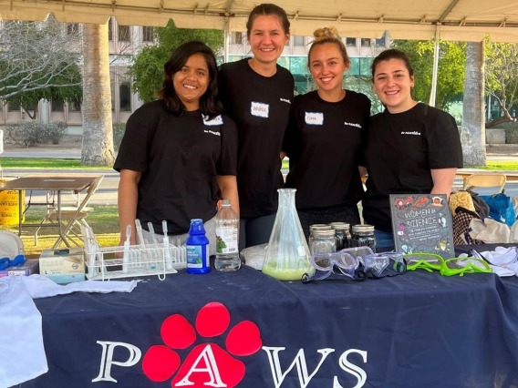 Group of PAWS members at a booth