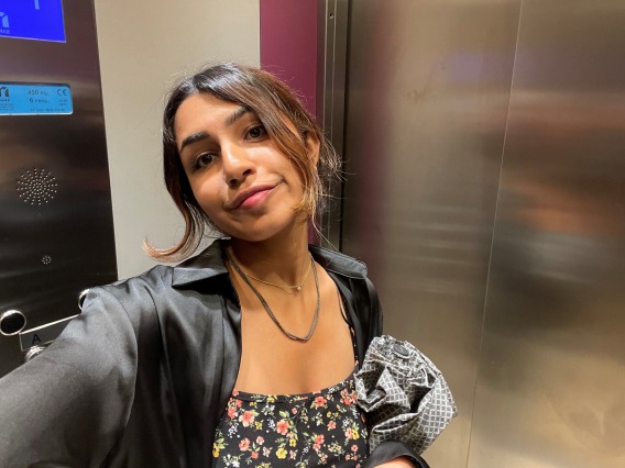 Grace Parekh taking a selfie in an elevator