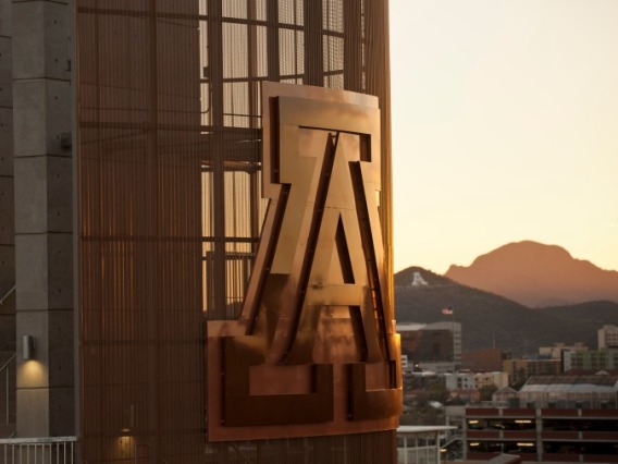 Photo of University of Arizona "A" on side of building with A Mountain in the background