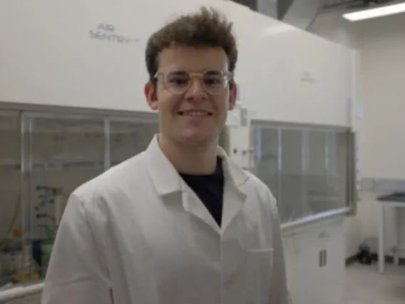 Dominic Dobai Smiling in a lab