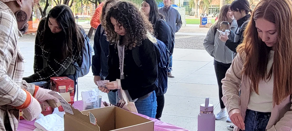 Students adding all the toppings at Cookies and Coco with CBC