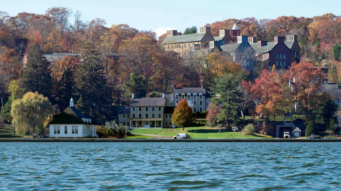 Photo of trees and homes along on a water front in Cold Spring Harbor National Lab in Long Island, New York.  