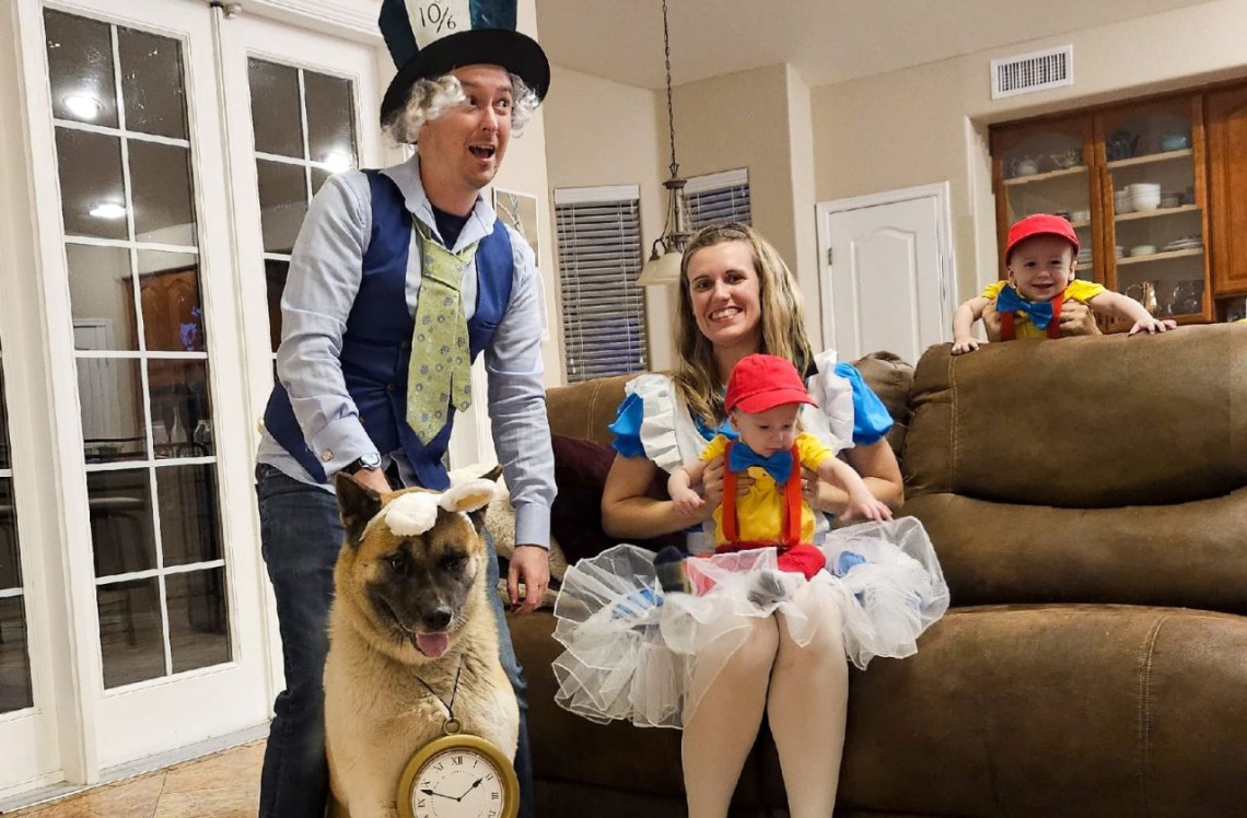 Alice in Wonderland Family – Carleen De Armon as Alice, husband as Mad Hatter, Dog as Rabbit, and baby as Tweedle Dee or Tweedle Dum