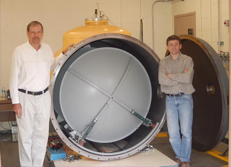 Dr. Kukolich with a large cavity spectrometer