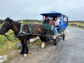 Tasmia and Paola on a horse and carriage