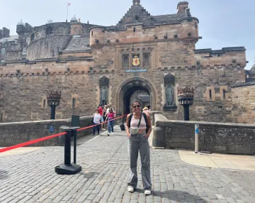 Anna in front of a building