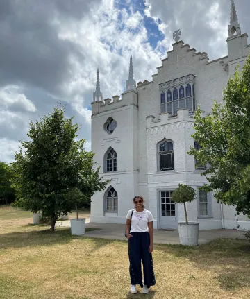 Anna in front a a building