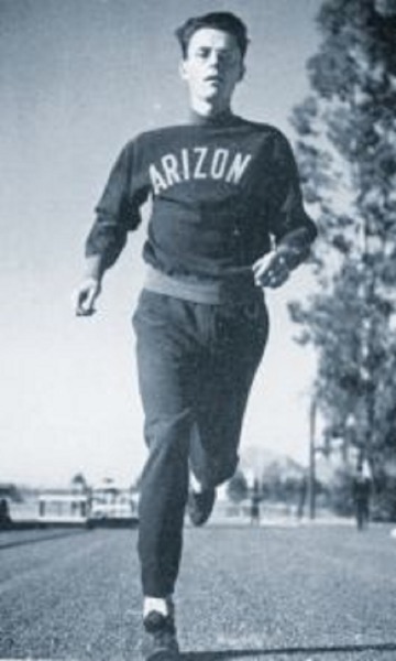 Photo of Homer C Weed running in an Arizona logo track suit